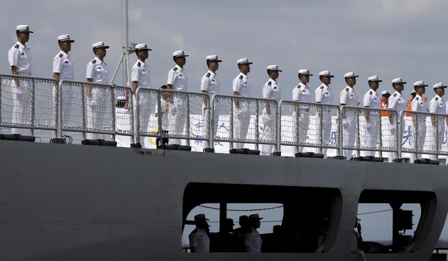 Chinese navy sailors stand in formation on board the naval training ship, Qi Jiguang, as it docks at Manila&#x27;s port, Philippines Wednesday, June 14, 2023. China says it&#x27;s navy ships are preparing for joint exercises with Russia&#x27;s sea forces in a sign of Beijing&#x27;s continuing support for Moscow&#x27;s invasion of neighboring Ukraine. (AP Photo/Basilio Sepe, File)