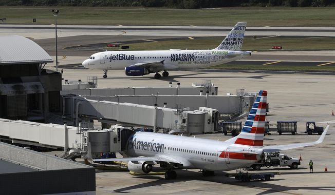 A JetBlue Airbus A320 taxis to a gate after landing, Oct. 26, 2016, as an American Airlines jet is seen parked at its gate at Tampa International Airport in Tampa, Fla. JetBlue on Wednesday, July 5, 2023, said it won&#x27;t appeal a judge&#x27;s ruling against its partnership with American Airlines, effectively dropping the deal in an effort to salvage its purchase of Spirit Airlines. (AP Photo/Chris O&#x27;Meara, File)