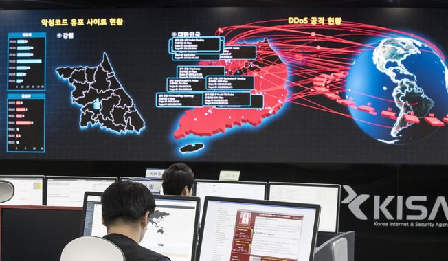 In this Monday, May 15, 2017, photo, employees watch an electronic board to monitor possible ransomware cyberattacks at the Korea Internet and Security Agency in Seoul, South Korea. (Yun Dong-jin/Yonhap via AP) **FILE**