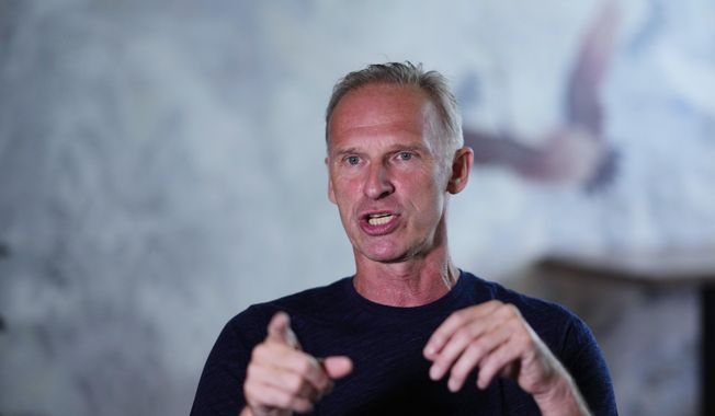 Former NHL goalkeeper Dominik Hasek gestures during an interview with The Associated Press in Prague, Czech Republic, Wednesday, June 28, 2023. The NHL great has been a prominent and vocal critic of the International Olympic Committee&#x27;s recommendation that Russians and Belarusians could compete in international competitions after being approved as neutrals. (AP Photo/Petr David Josek)