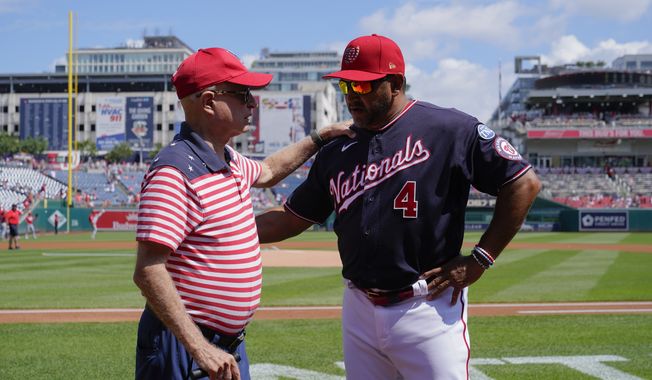 Washington Nationals principal owner Mark Lerner, left, chats with Nationals manager Dave Martinez before a baseball game between the Nationals and the Cincinnati Reds, Tuesday, July 4, 2023, in Washington. (AP Photo/Patrick Semansky) **FILE**